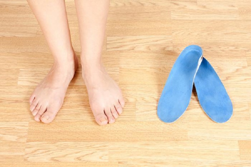 What are the benefits of custom foot orthotics